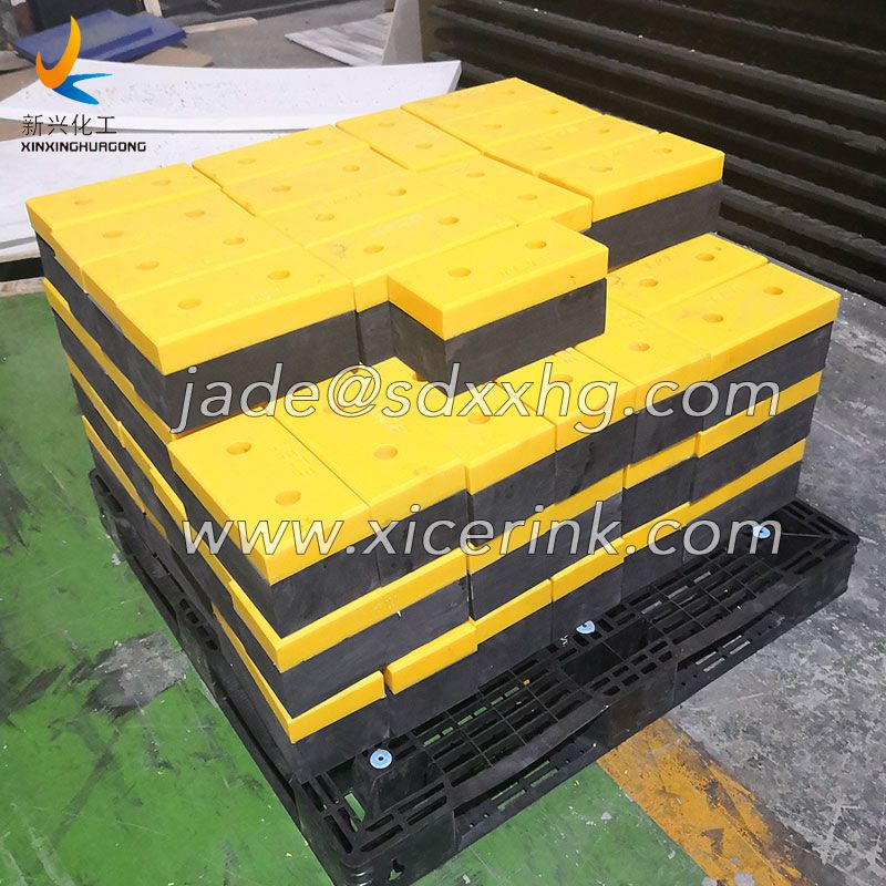 sliding dock bumper with UHMWPE block