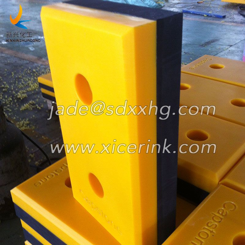 sliding dock bumper with UHMWPE block